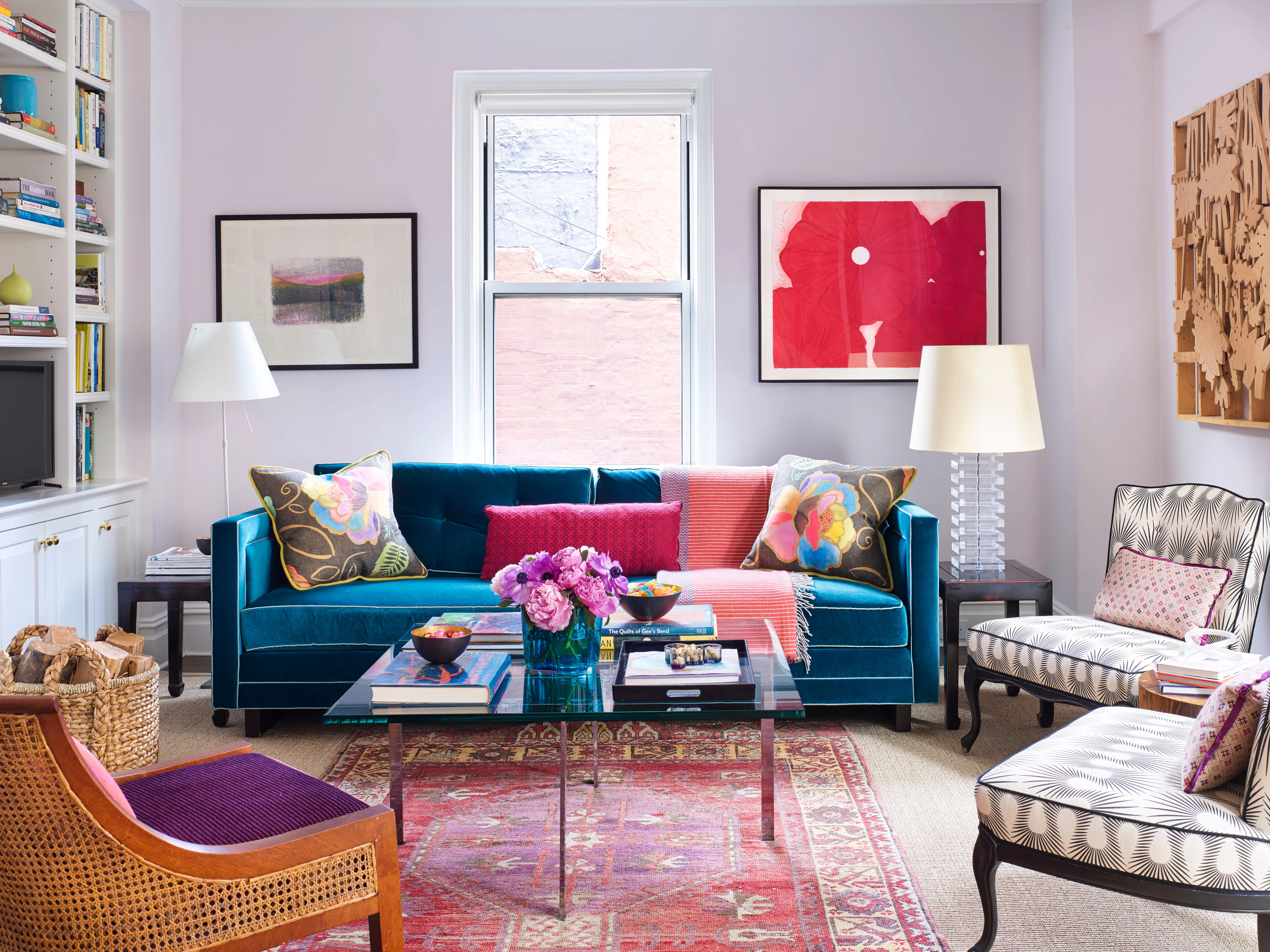 Living room with lavender walls and a blue couch