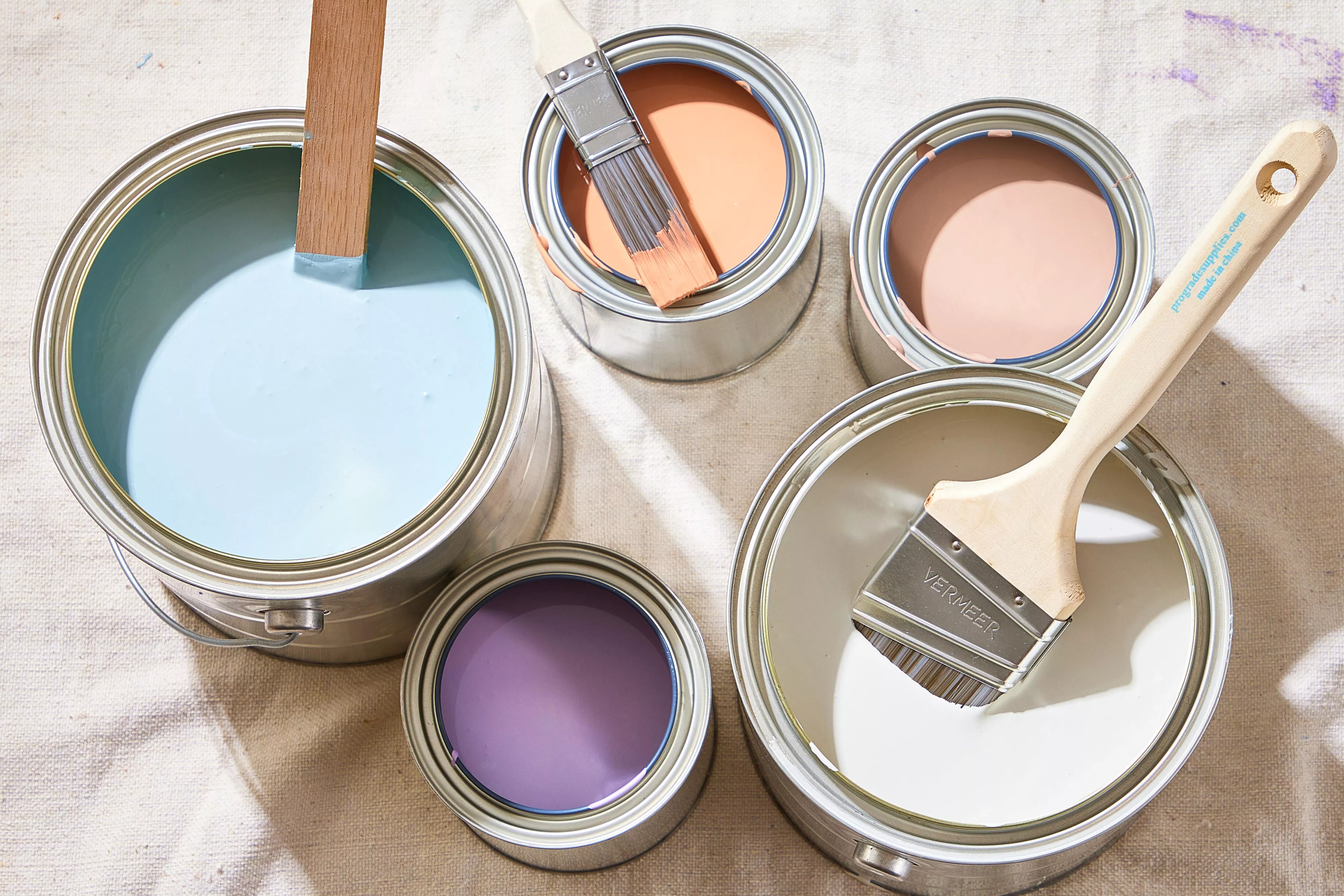 Open paint cans in various colors