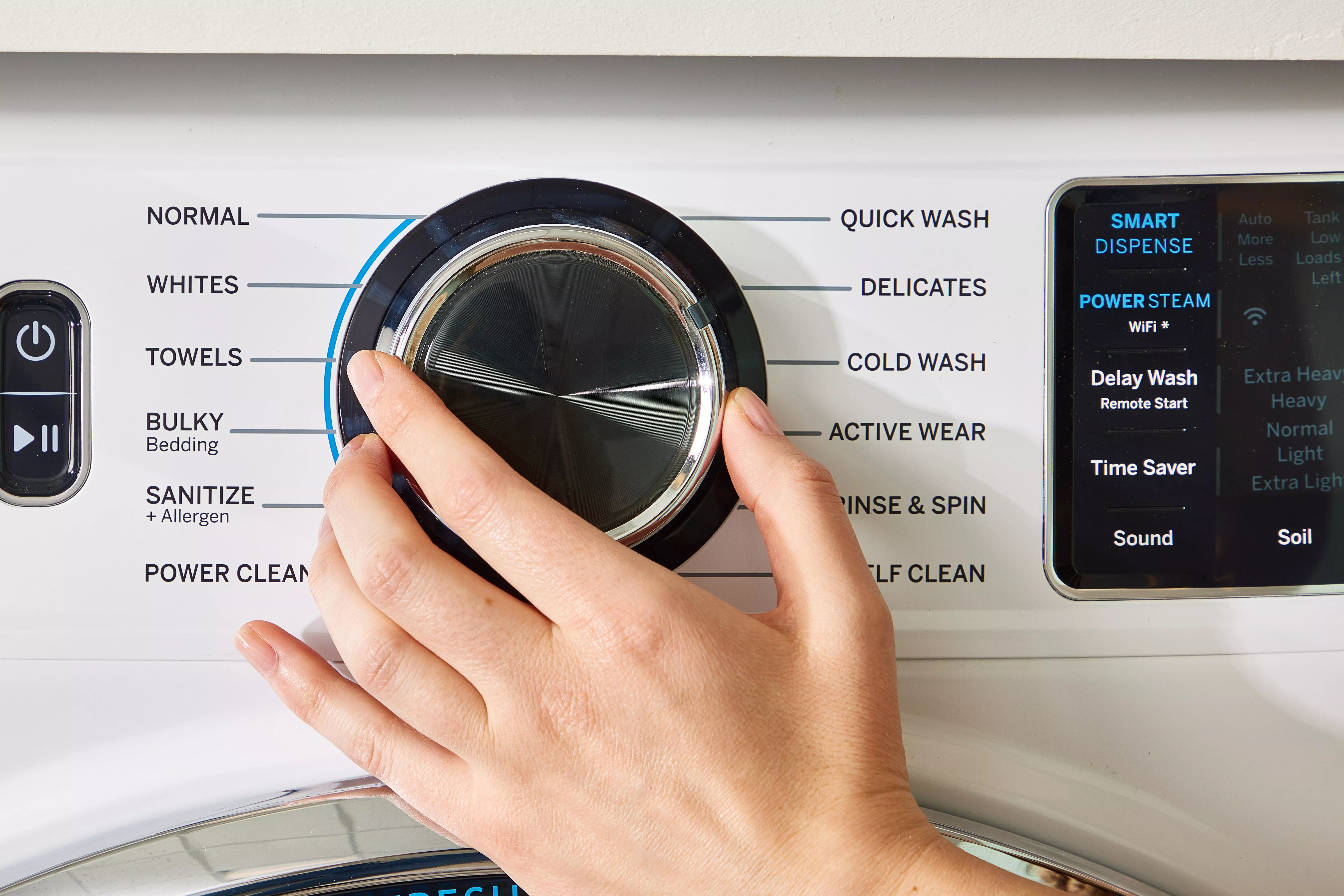 turning dial on washing machine