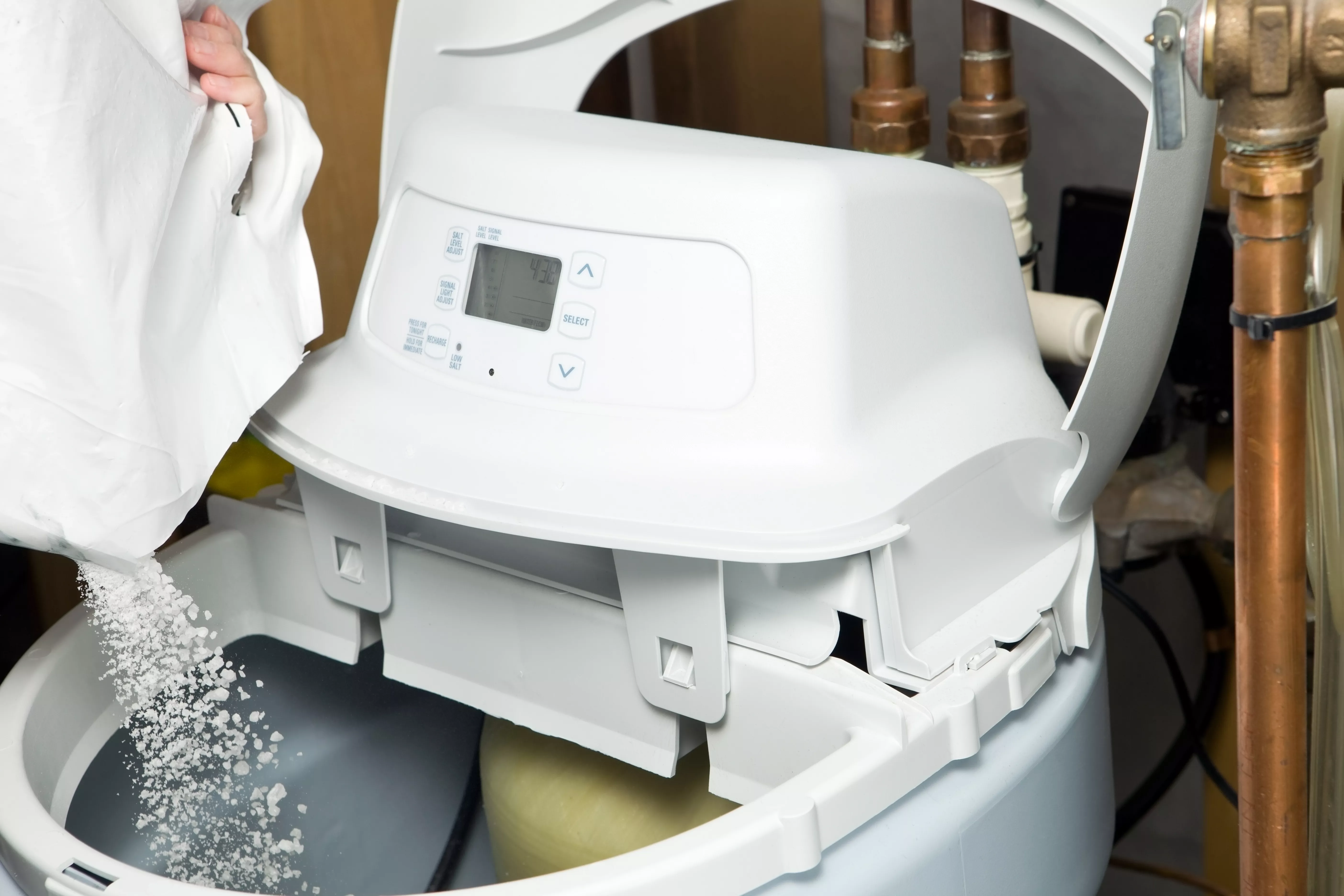 water softener being filled with salt